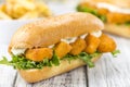 Roll with fried Fish Sticks (close-up shot) Royalty Free Stock Photo