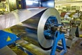 Roll of galvanized steel sheet for manufacturing metal pipes and tubes in the factory Royalty Free Stock Photo