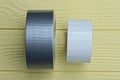 a roll of gray reinforced tape and a roll of white tape Royalty Free Stock Photo