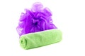 A roll of green towel with purple sponge Royalty Free Stock Photo