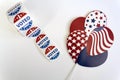 Roll of I Voted Today stickers and USA balloons on white background. US presidential election concept Royalty Free Stock Photo