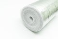 A roll of insulation made of foamed polyethylene with aluminum foil. Thermal insulation with reflective foil. Selective