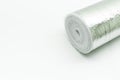 A roll of insulation made of foamed polyethylene with aluminum foil. Thermal insulation with reflective foil. Selective