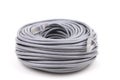 Roll of internet data cable isolated on a white background. Grey network cable. Royalty Free Stock Photo