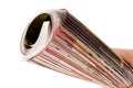 Roll of magazine in hand Royalty Free Stock Photo