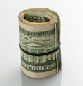 Roll of $20 dollar bills on white table Royalty Free Stock Photo