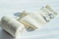 Roll of medical elastic bandage, with mount, deployed on a white background Royalty Free Stock Photo