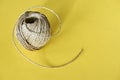 Roll of natural sisal twine on yellow Royalty Free Stock Photo