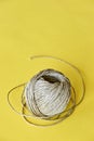 Roll of natural sisal twine on yellow Royalty Free Stock Photo