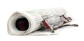 Roll of newspapers with eyeglasse