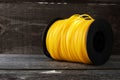 Roll Nylon Trimmer Line for grass trimmer on an old wooden background