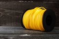 Roll Nylon Trimmer Line for grass trimmer on an old wooden background Royalty Free Stock Photo