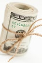 One Hundred Dollar Bills Roll Tied in Burlap String on White Royalty Free Stock Photo