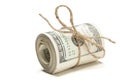 Roll of One Hundred Dollar Bills Tied in Burlap String on White Royalty Free Stock Photo