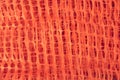 A roll of orange plastic protective barrier mesh. Plastic mesh for fencing, safety warning mesh Royalty Free Stock Photo