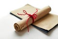 Roll of paper with red string tied around it. Generative AI Royalty Free Stock Photo