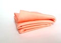 A roll of peach color, soft cotton fabric