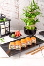 Roll Philadelphia made of Fresh Salmon, Cream Cheese, avocado and cucumber inside. Salmon sushi roll. Royalty Free Stock Photo