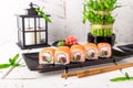 Roll Philadelphia made of Fresh Salmon, Cream Cheese, tuna, avocado and cucumber inside. Salmon sushi roll. Royalty Free Stock Photo