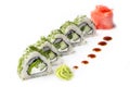 Roll with pieces of cucumber and Philadelphia cheese. Isolated. Sushi roll turned on a white background. Sushi Japanese food in a Royalty Free Stock Photo