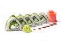 Roll with pieces of cucumber and Philadelphia cheese. Isolated. Sushi roll turned on a white background. Sushi Japanese food in a Royalty Free Stock Photo