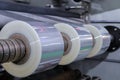 Roll of plastic packaging film on the automatic packing machine in food product factory. industrial and technology concept Royalty Free Stock Photo