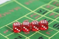 Roll of the red dice on a game table Royalty Free Stock Photo