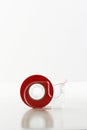 Roll Of Red Tape In Dispenser