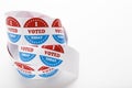 Roll of red white and blue I voted stickers with American flag