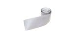 A roll of reflective tape on a white background, close-up, isolate, visibility, light reflection tape, equipment