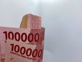 roll of 100000 rupiah bills. banknote of 100000 rupiah. Isolated on white background with copyspace Royalty Free Stock Photo