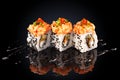 Roll with salmon, shrimp, caviar, cream cheese and spicy sauce