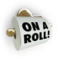 On a Roll - Saying on Toilet Paper Dispenser Royalty Free Stock Photo