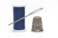 roll sewing thread needle thimble white background Royalty Free Stock Photo