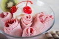 Roll of Strawberry ice cream. Fresh fried berry ice cream, ice Royalty Free Stock Photo