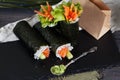 Roll sushi black background different tastes, crab, carrots, lettuce, tofu, salmon, still life, home, stylish, wooden worktops