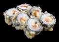 Roll tempura with salmon and vegetables on black background