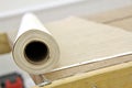 Roll of wallpaper on bench Royalty Free Stock Photo