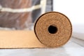 Roll of wood cork on the floor in a room before laying the flooring. Cork - a natural material.