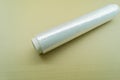 Roll of wrapping plastic stretch film. Packaging film in a roll on a cardboard spool. Selective focus Royalty Free Stock Photo