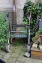 rollator of a senior lady on an old cottage entrance area Royalty Free Stock Photo