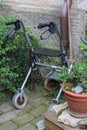 rollator of a senior lady on an old cottage entrance area Royalty Free Stock Photo