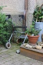 rollator of a senior lady on an old cottage entrance area