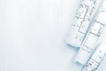 rolled architectural blueprints for house renovation on architect workplace Royalty Free Stock Photo
