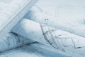 Rolled architectural plans lying on drawing board Royalty Free Stock Photo