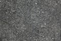 Rolled asphalt grainy texture wallpaper. Rolled bitumen surface desktop picture. Rolled bitumen background. Royalty Free Stock Photo