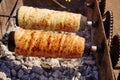 Rolled bakery meat rolls in charcoal Royalty Free Stock Photo