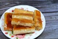 rolled baklava, a sweet middle eastern dessert stuffed with nuts, raisins and shredded coconuts, and soaked with honey sugar syrup