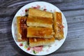 rolled baklava, a sweet middle eastern dessert stuffed with nuts, raisins and shredded coconuts, and soaked with honey sugar syrup