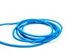 rolled blue plastic cord on a white background